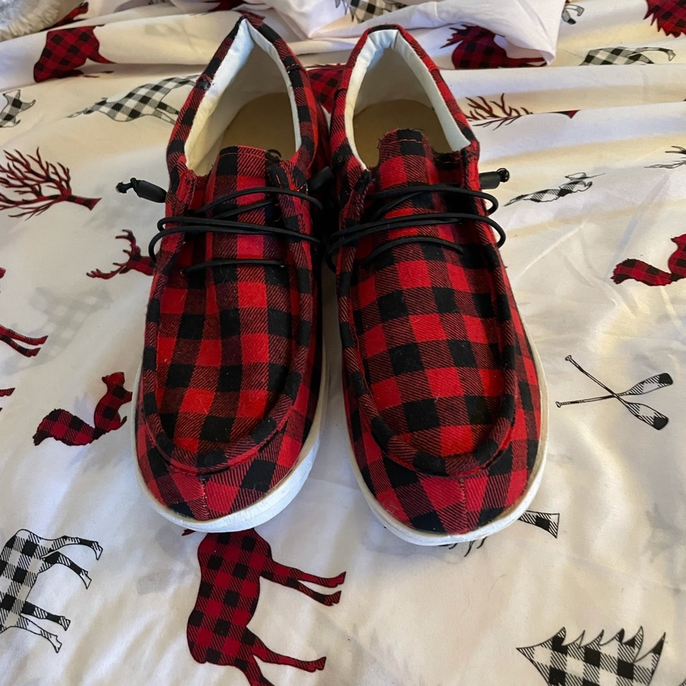 Outwoods brand women’s slip on red/black Checker pattern cotton canvas shoes.